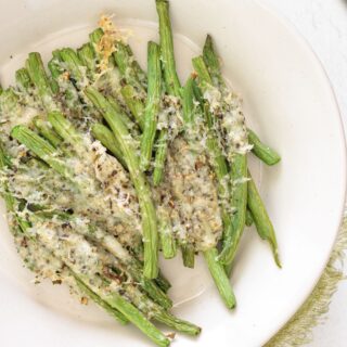 Oven-baked green beans cooked to tender perfection with cheese