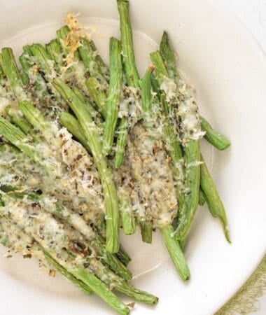 Oven-baked green beans cooked to tender perfection with cheese