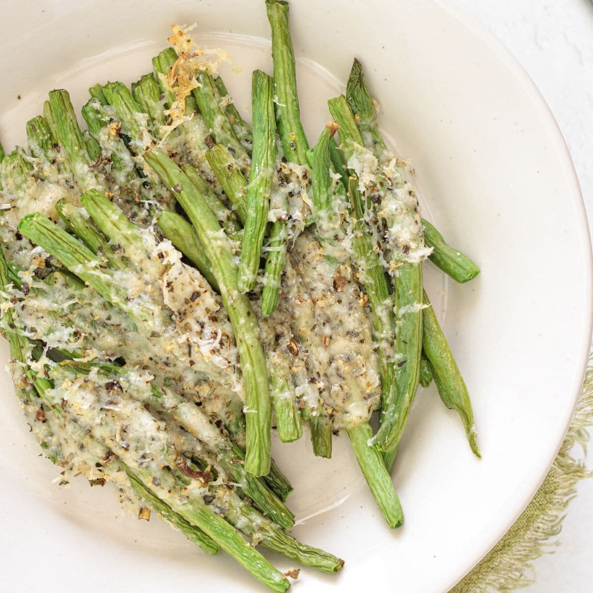 Oven-baked green beans cooked to tender perfection with cheese