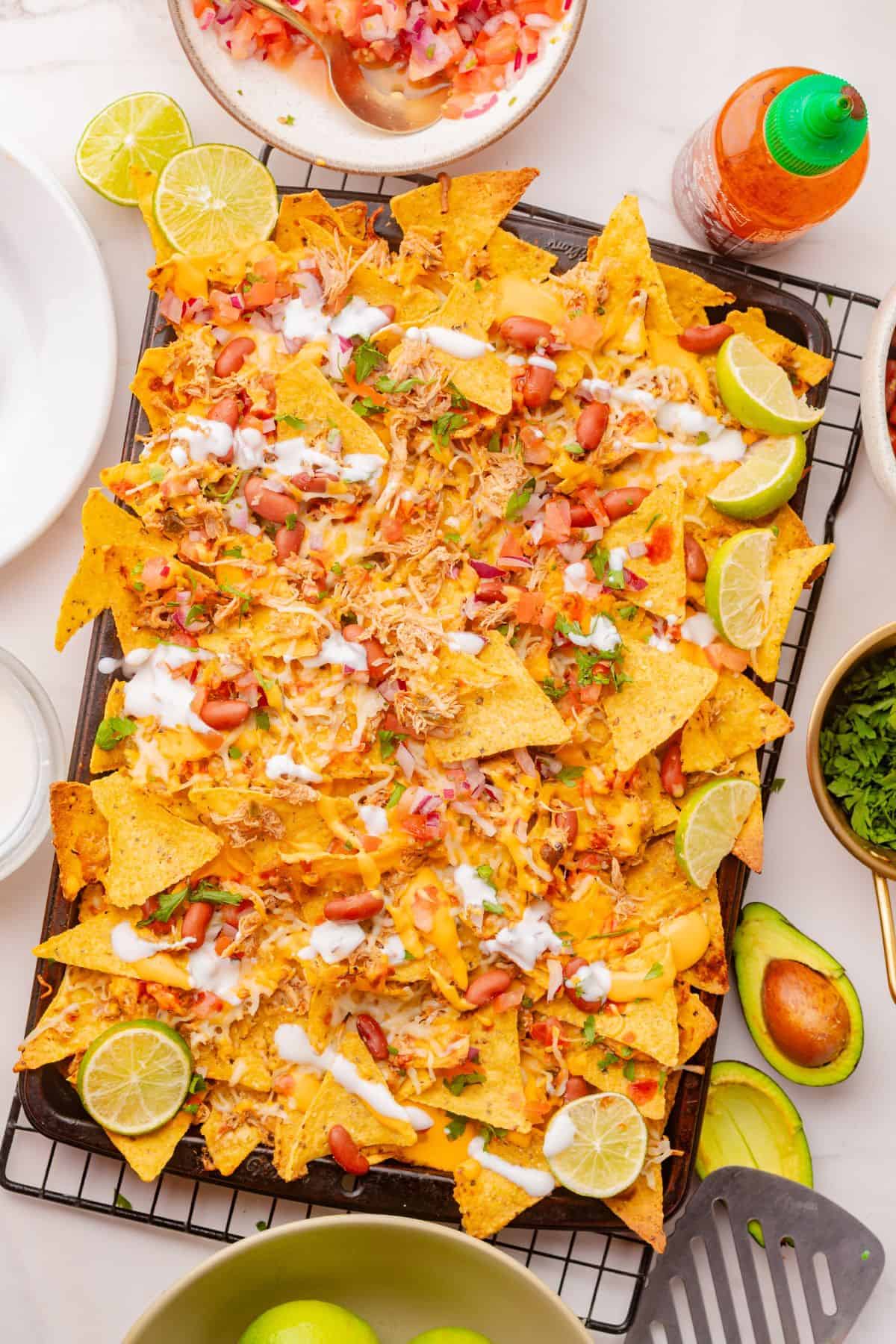 Sheet pan nachos with melted cheese and tender chicken