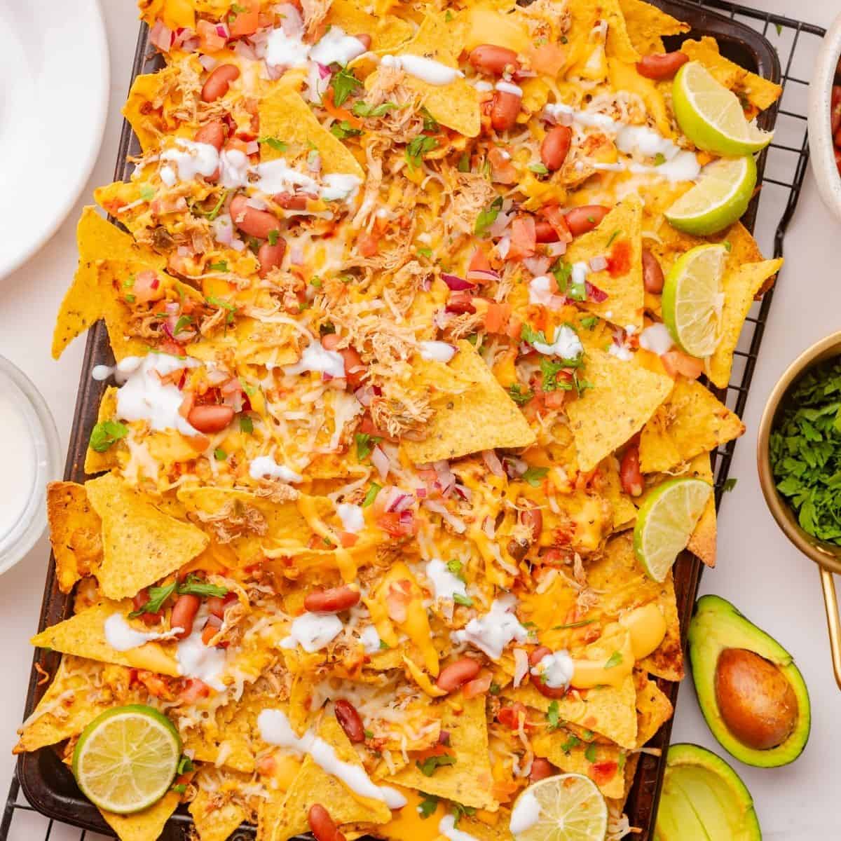 Loaded nacho platter with Mexican shredded chicken and cheese
