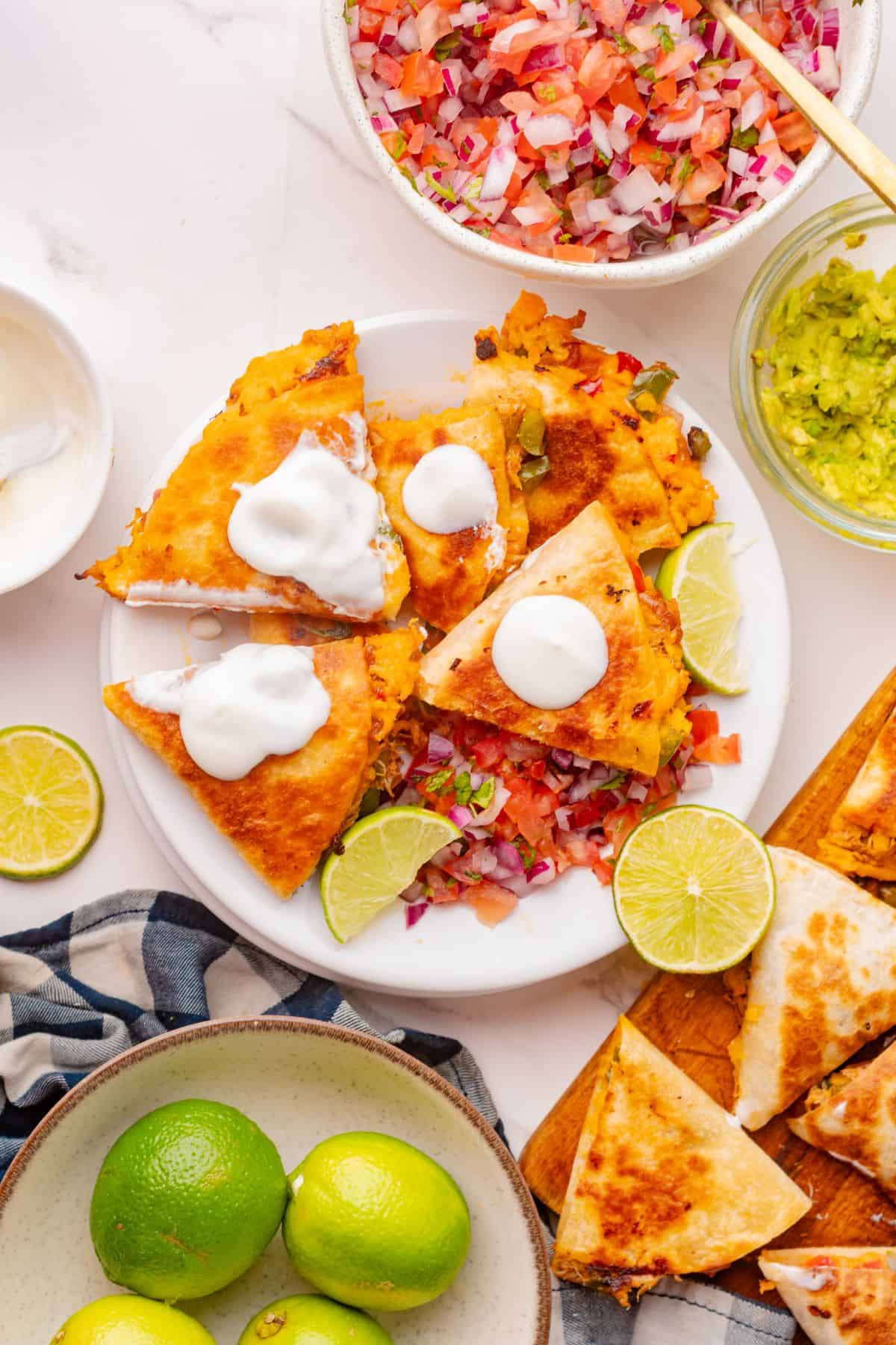 Toasted quesadilla with shredded chicken and melted cheese inside, ready to serve