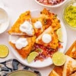 Cheesy shredded chicken quesadilla with saut&eacute;ed peppers on a serving plate