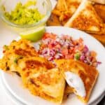 Crispy tortilla filled with cheesy shredded chicken and vegetables