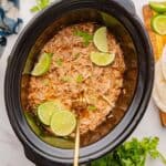 Shredded chicken with fire-roasted tomatoes and green chilies in a slow cooker