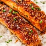 Salmon fillet glazed with teriyaki sauce alongside steamed rice