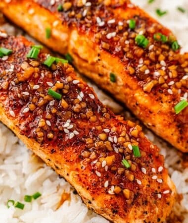 Salmon fillet glazed with teriyaki sauce alongside steamed rice