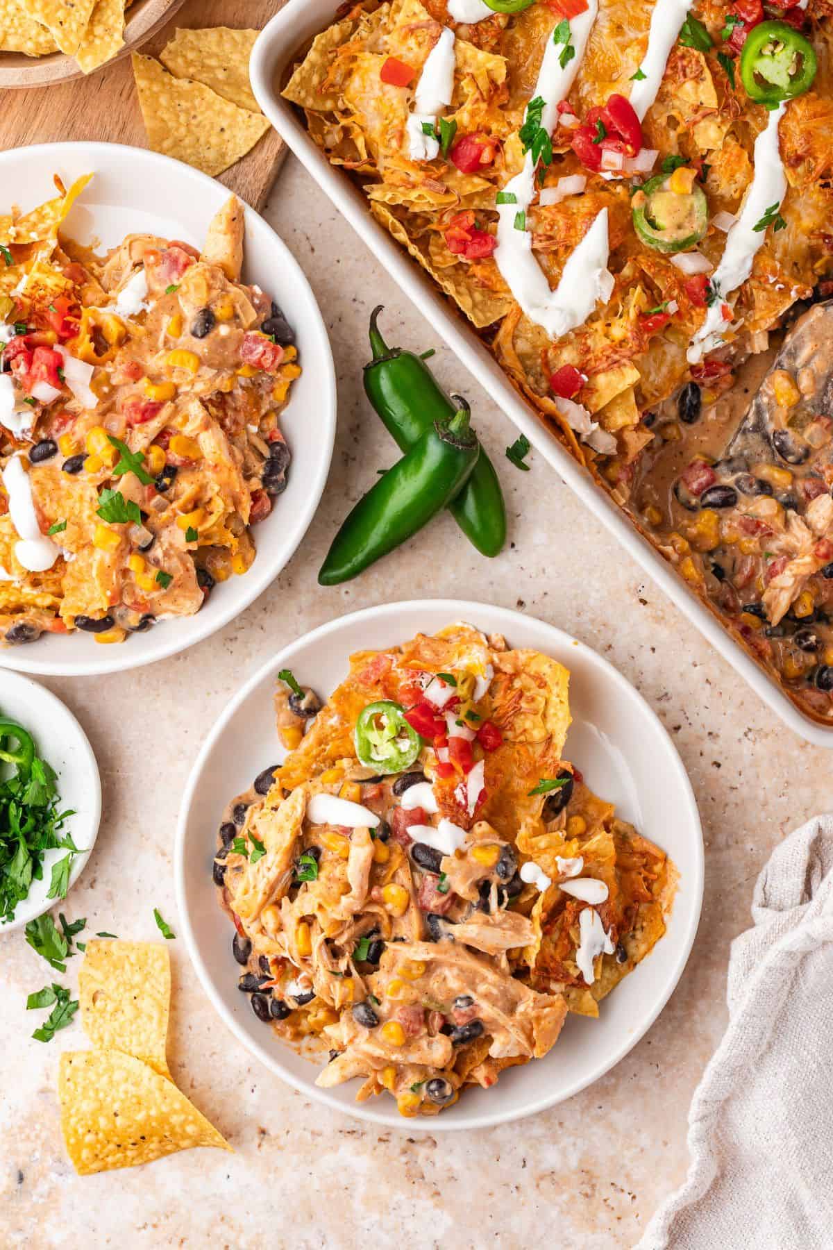Shredded chicken Mexican casserole with corn, beans, and queso-style sauce