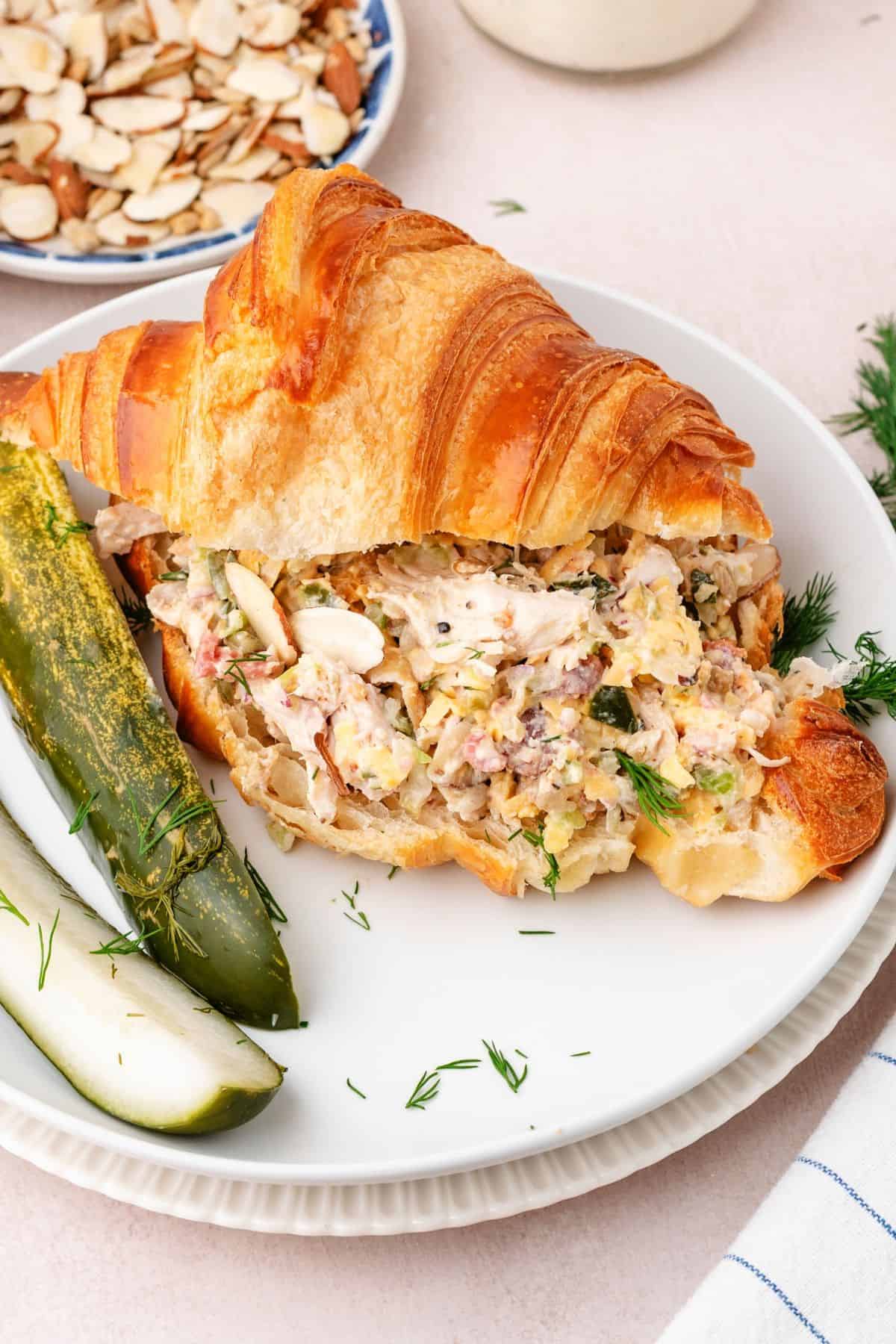 Chicken salad with dill pickles and mayo stuffed into a flaky croissant