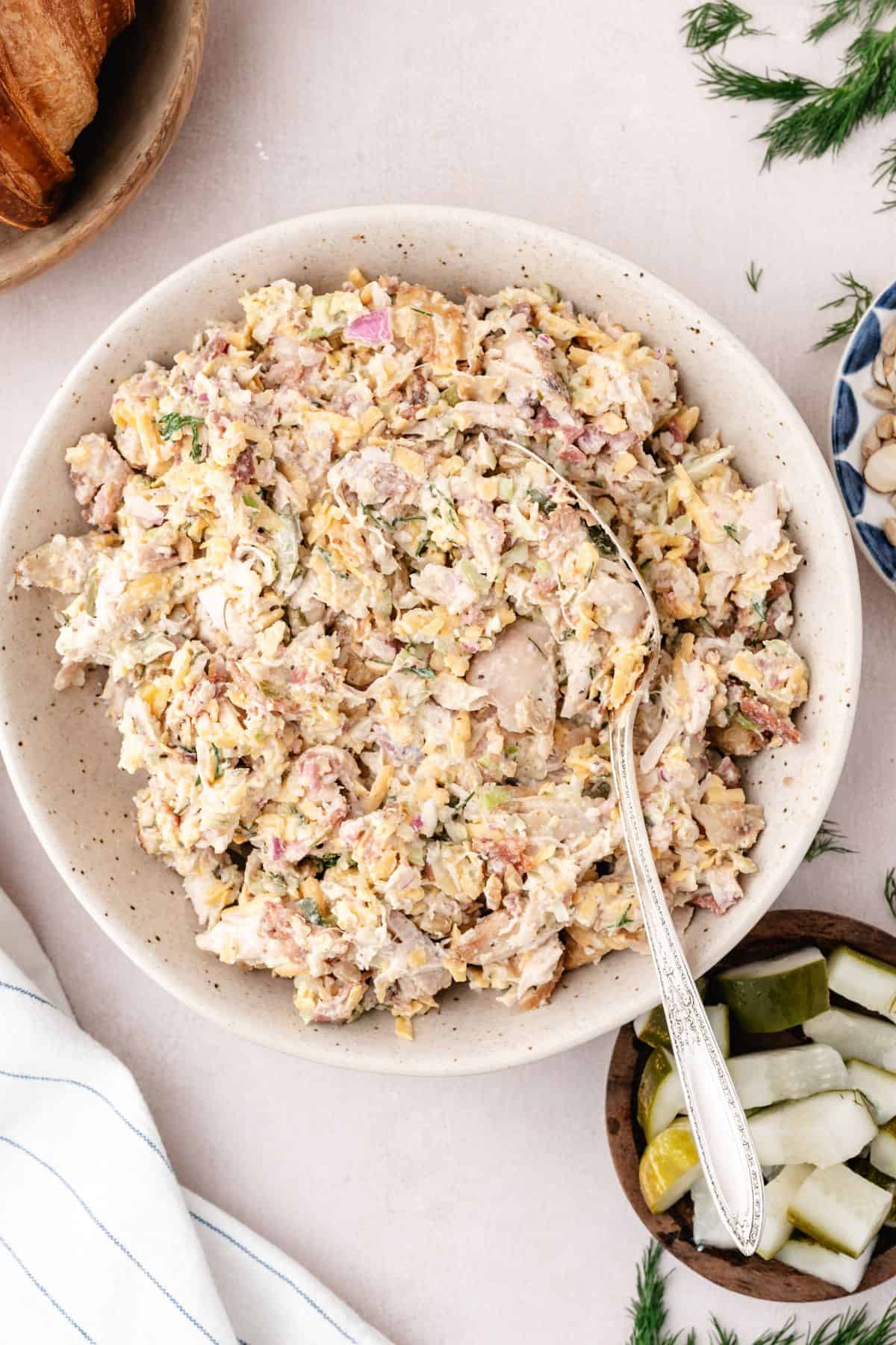 Dill pickle chicken salad served creamy with bacon, cheddar, and fresh dill