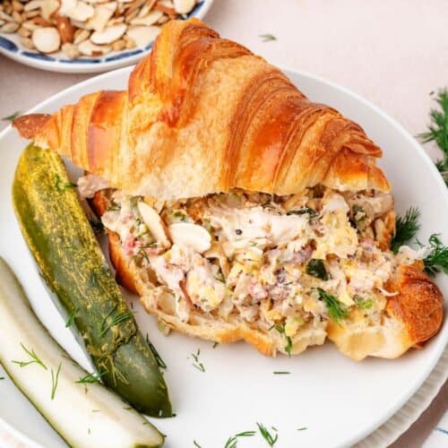 Dill pickle chicken salad recipe served as a croissant sandwich