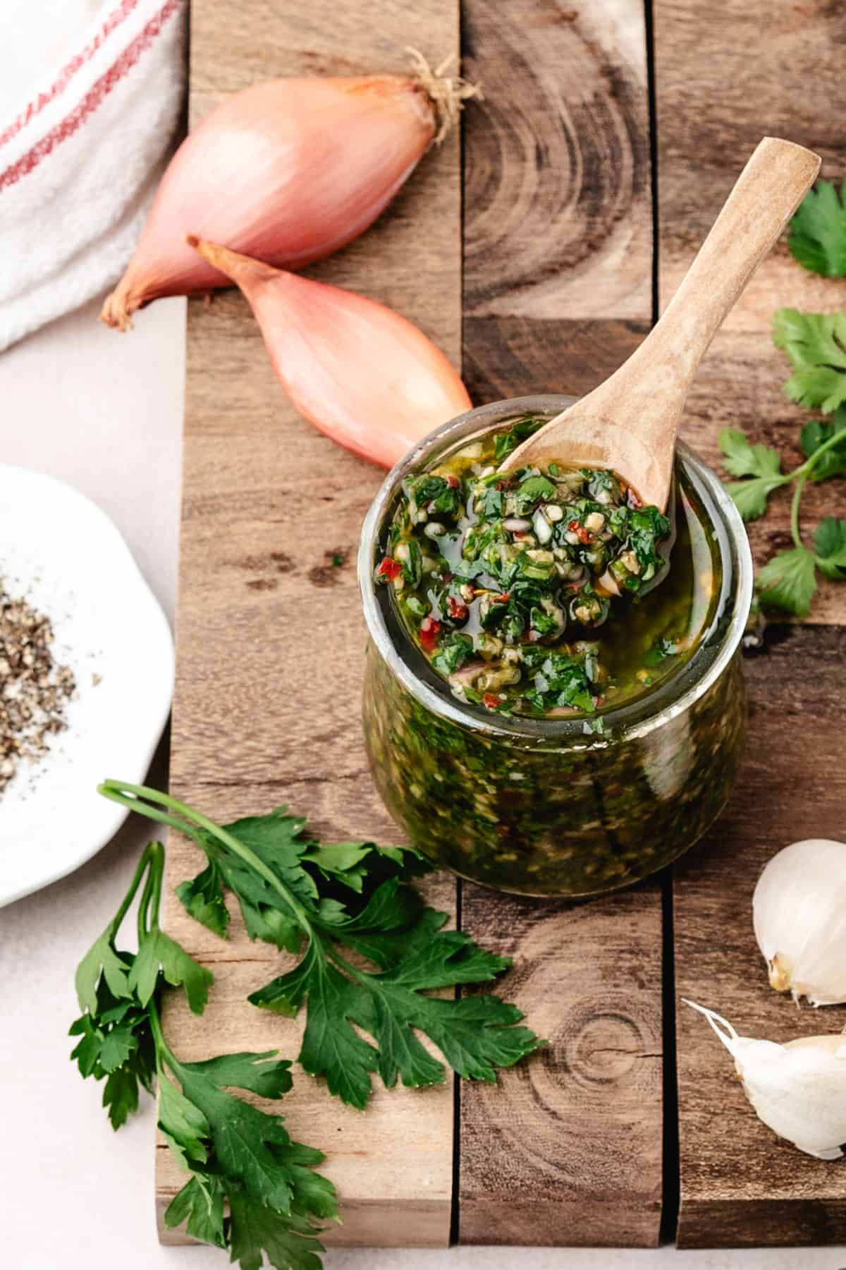 Homemade parsley chimichurri sauce in a small bowl