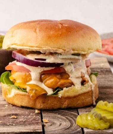 Ground chicken burger recipe styled with fresh toppings and sauce