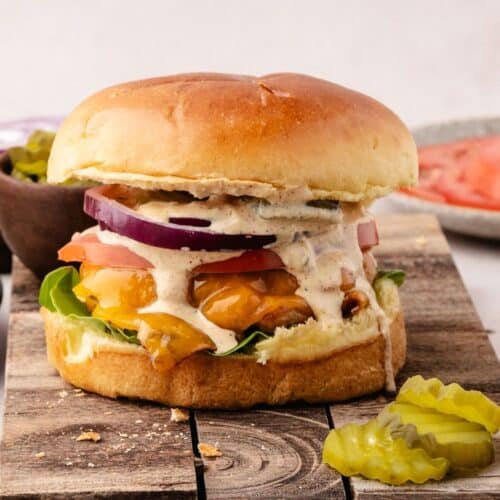 Ground chicken burger recipe styled with fresh toppings and sauce