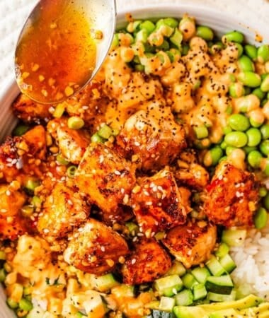 Teriyaki salmon bowl recipe with creamy avocado and cucumber