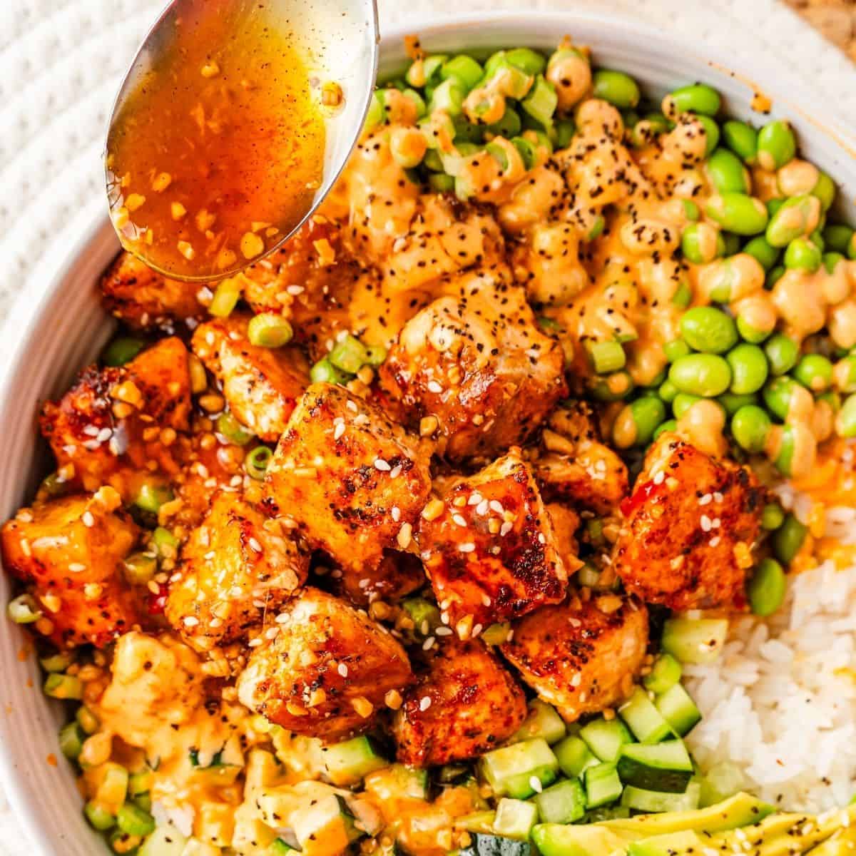 Teriyaki salmon bowl recipe with creamy avocado and cucumber
