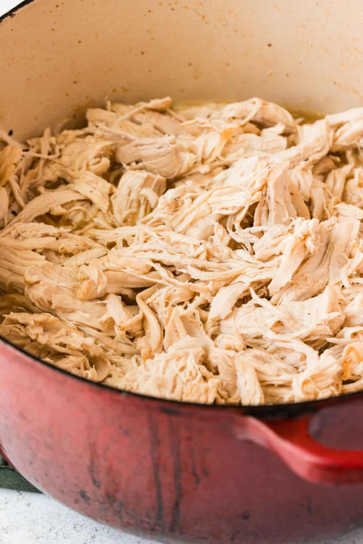 Dutch oven chicken breast shredded into tender juicy pieces