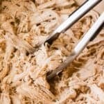 Shredded chicken in Dutch oven seared and slow braised in butter