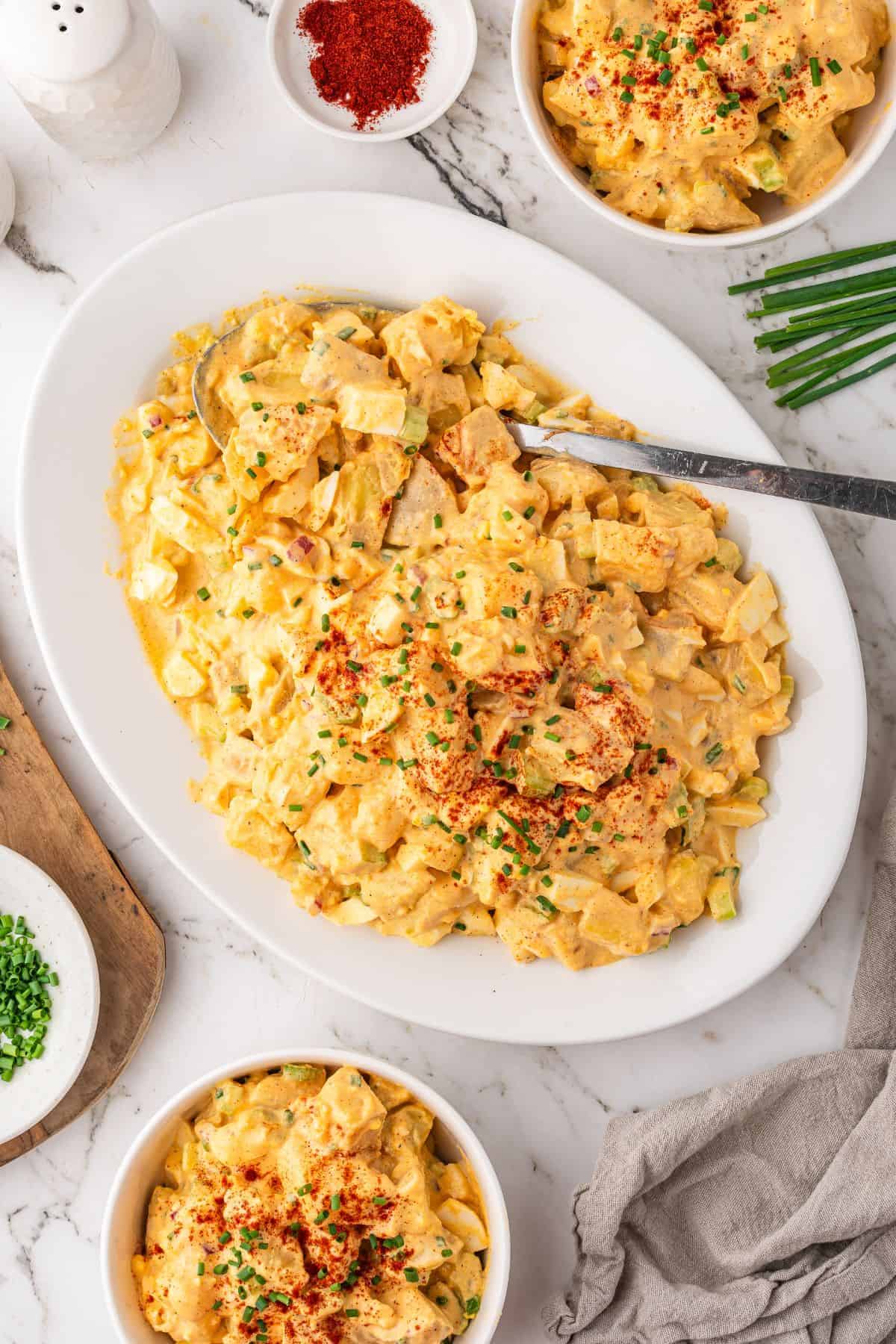 Creamy deviled egg potato salad with crunchy texture and herbs