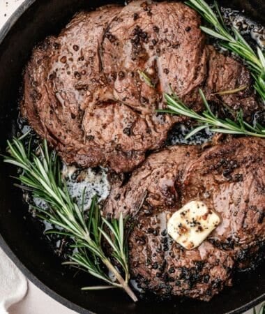 Cast iron pan seared steak with crispy browned edges and juicy center