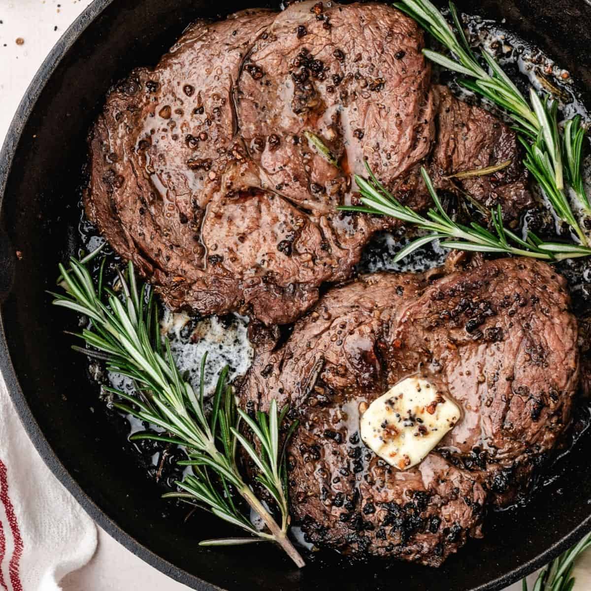 Cast iron pan seared steak with crispy browned edges and juicy center