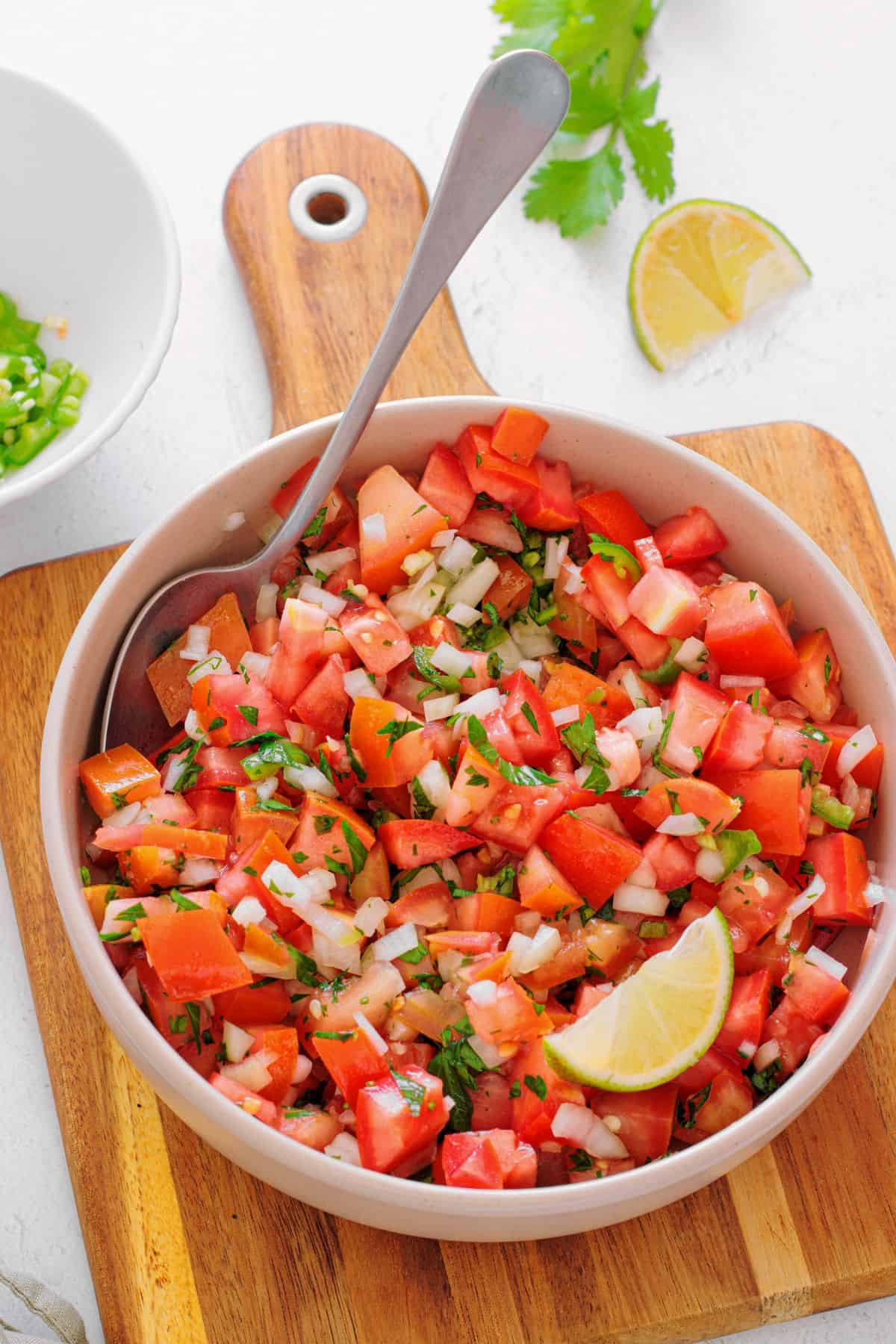 Pico de gallo ingredients mixed together in a colorful salsa
