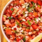 Easy pico de gallo recipe with tomatoes, onions, and jalapeños