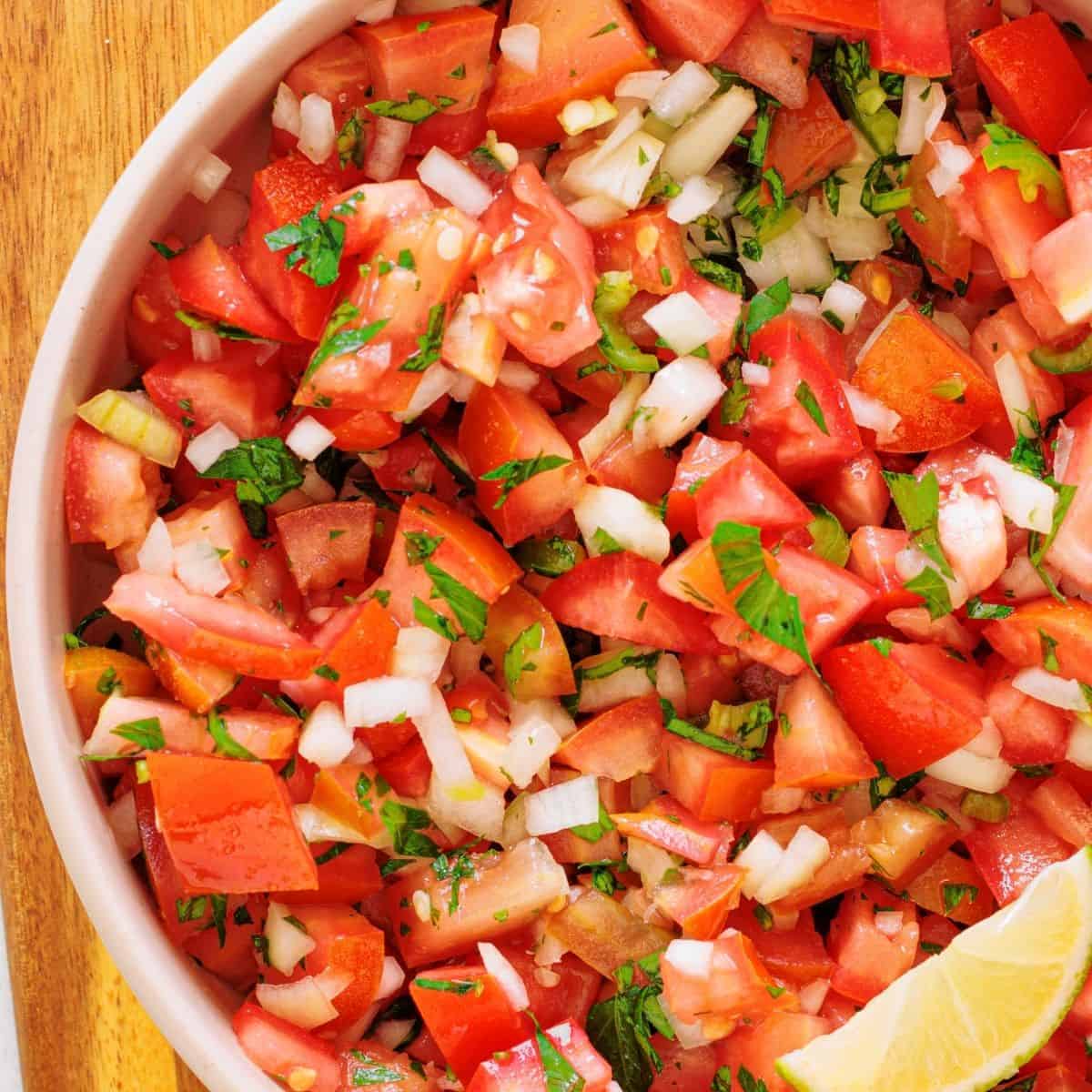 Easy pico de gallo recipe with tomatoes, onions, and jalape&ntilde;os