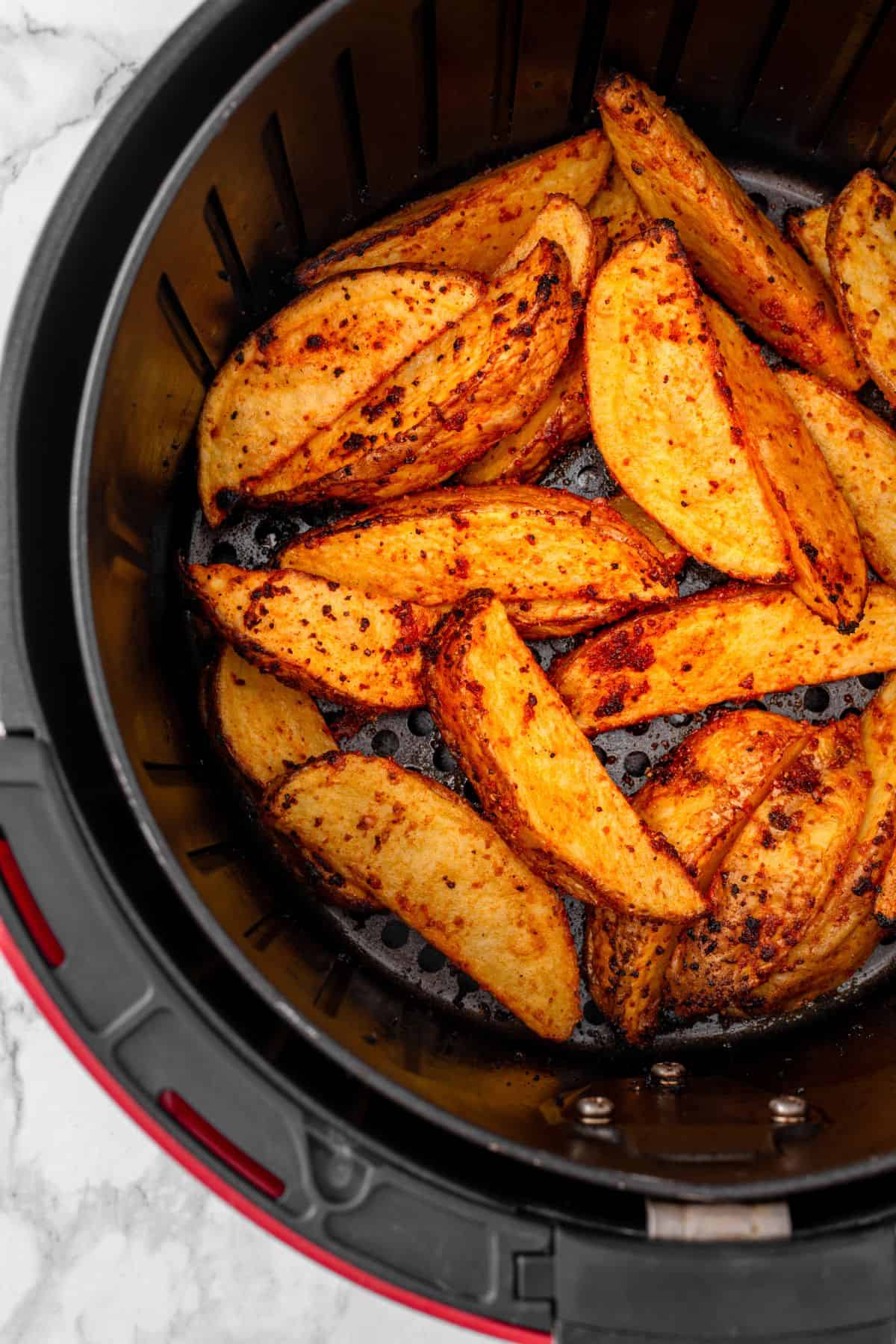 Air fried potato wedges seasoned and cooked until golden