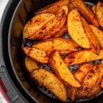 Air fryer potato wedges seasoned and cooked to golden perfection