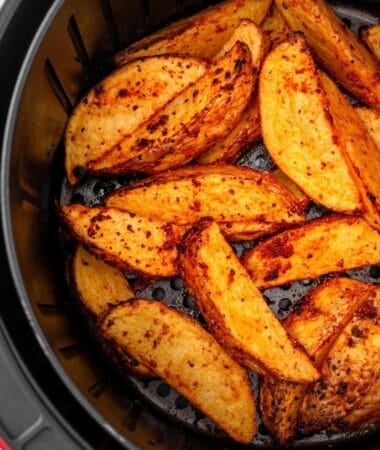 Air fryer potato wedges seasoned and cooked to golden perfection