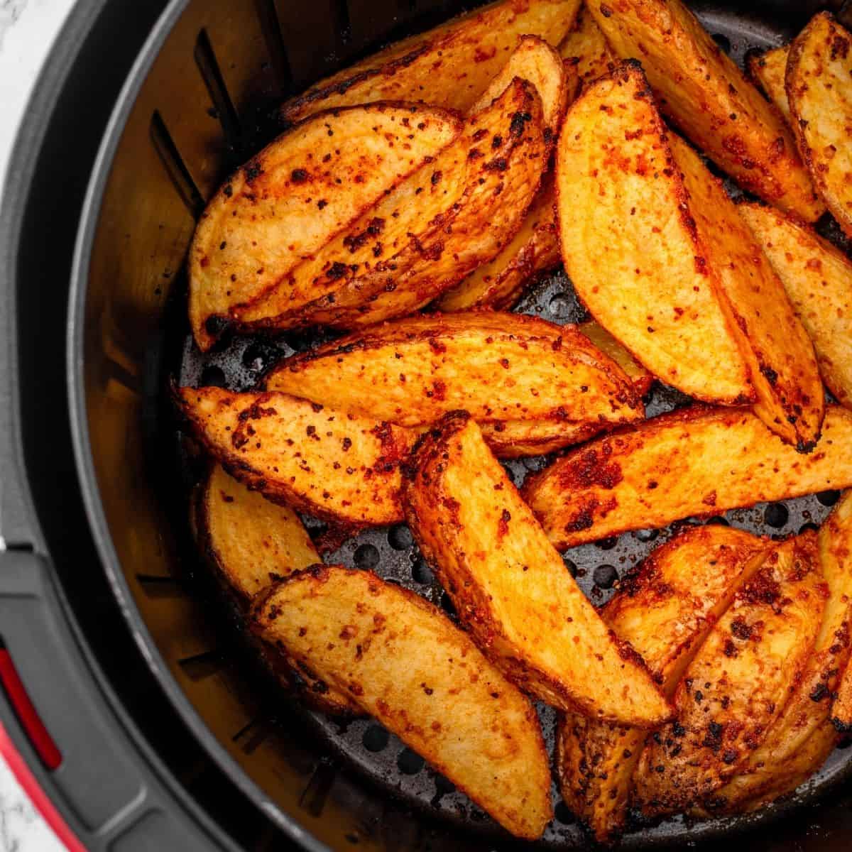 Air fryer potato wedges seasoned and cooked to golden perfection