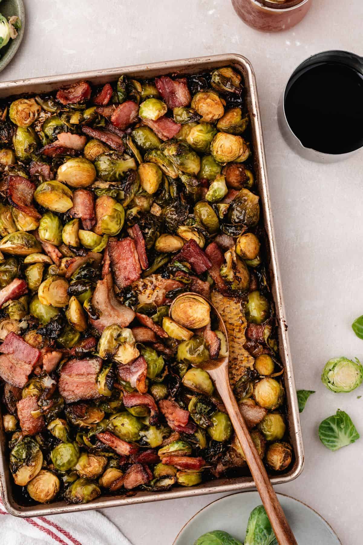 Brussels sprouts baked with bacon on a sheet pan until golden
