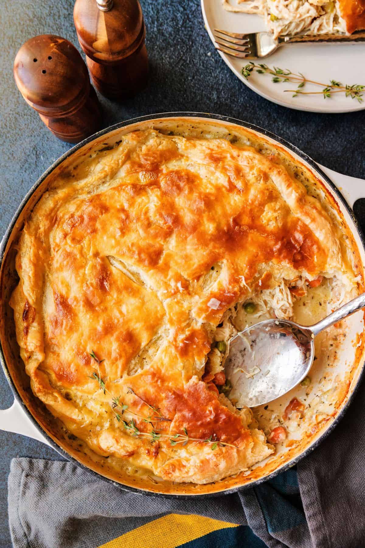 Homemade chicken pot pie in a skillet with golden brown crust