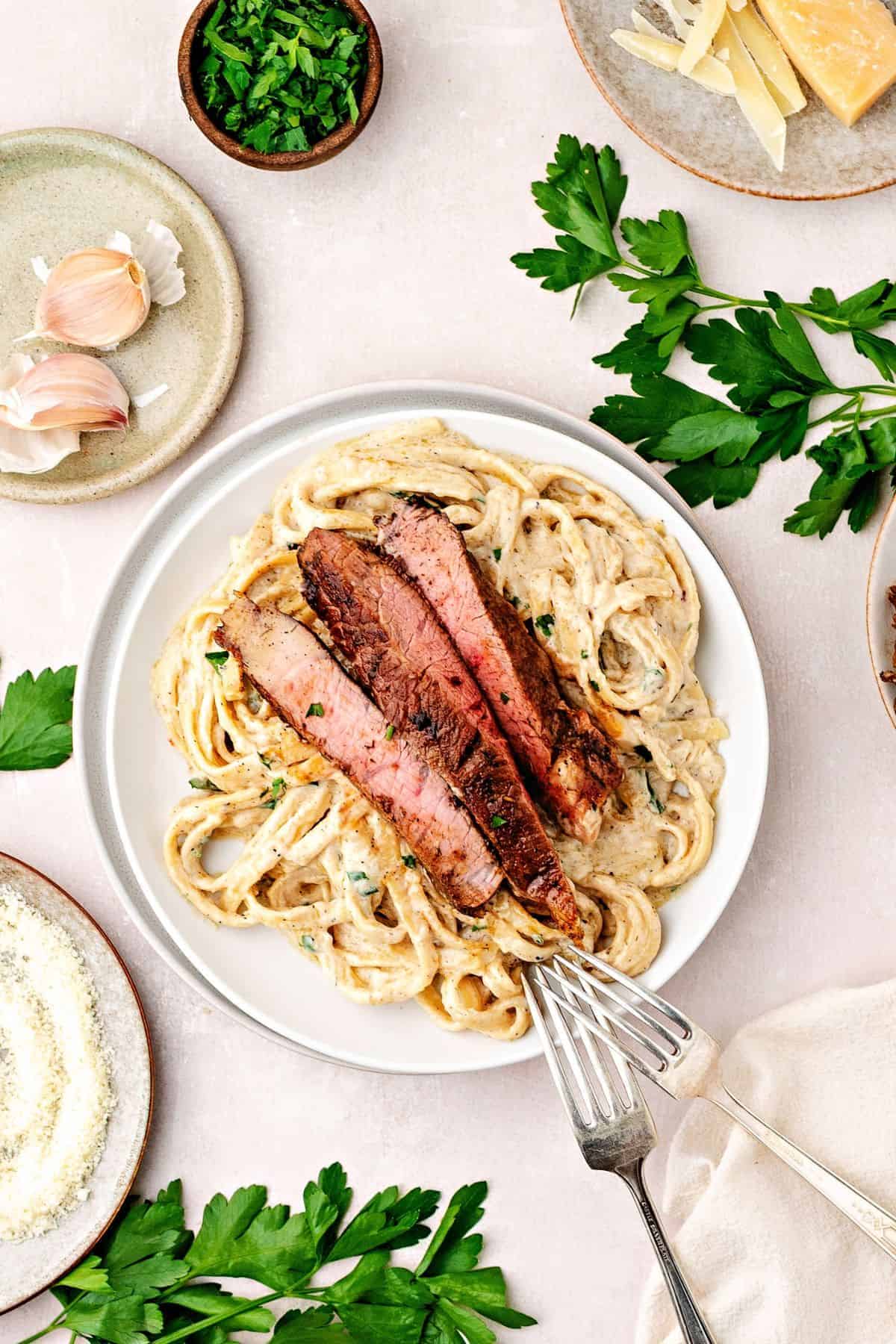 Restaurant-style steak pasta served with rich Parmesan cream sauce