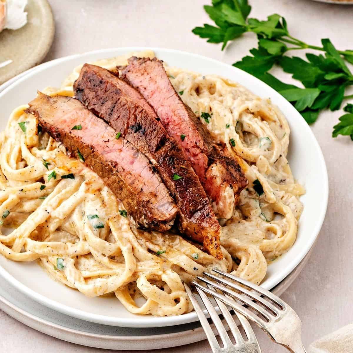 Homemade steak pasta with rich cream sauce and tender steak slices