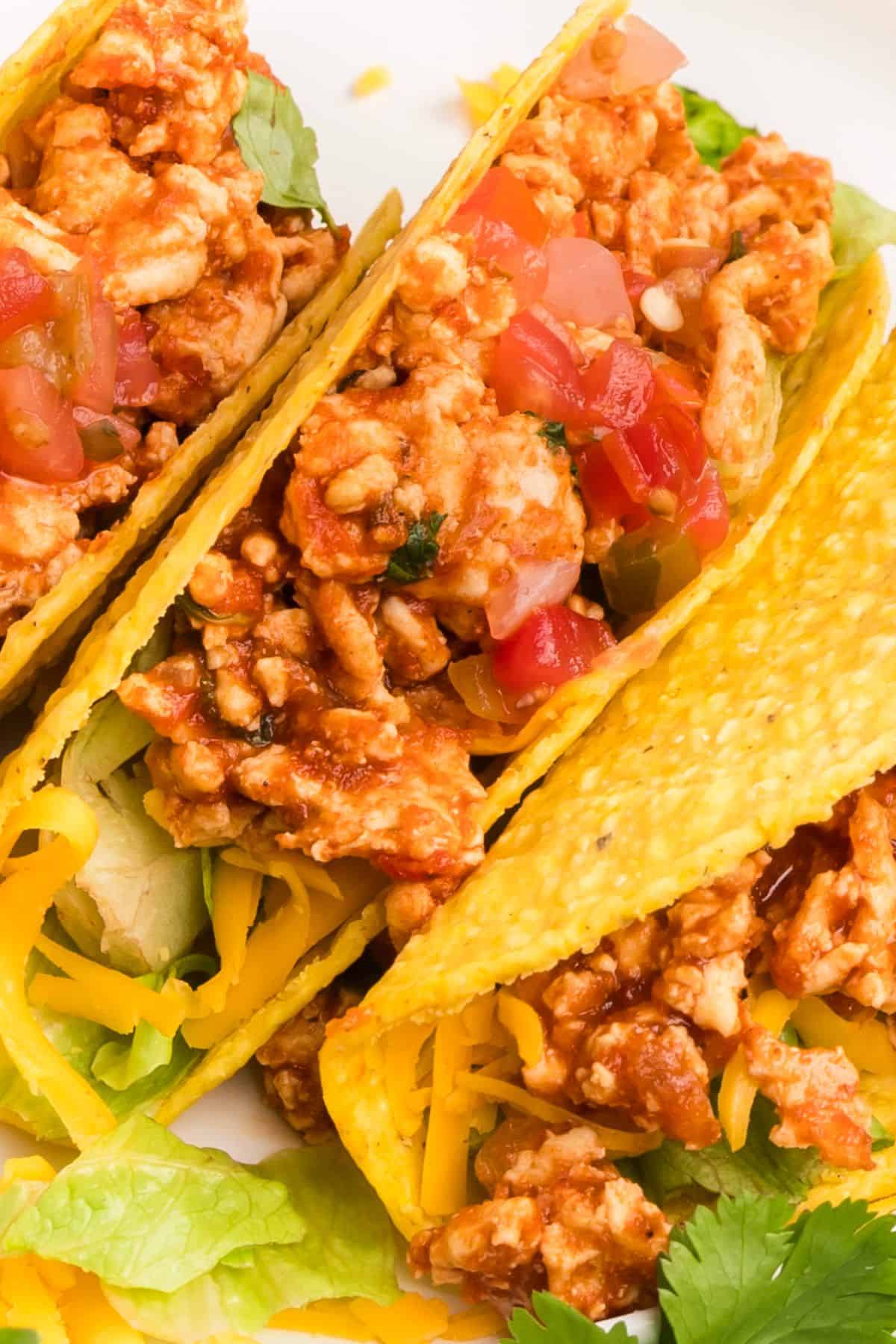 Chicken tacos ground chicken filling served in warm tortillas with toppings
