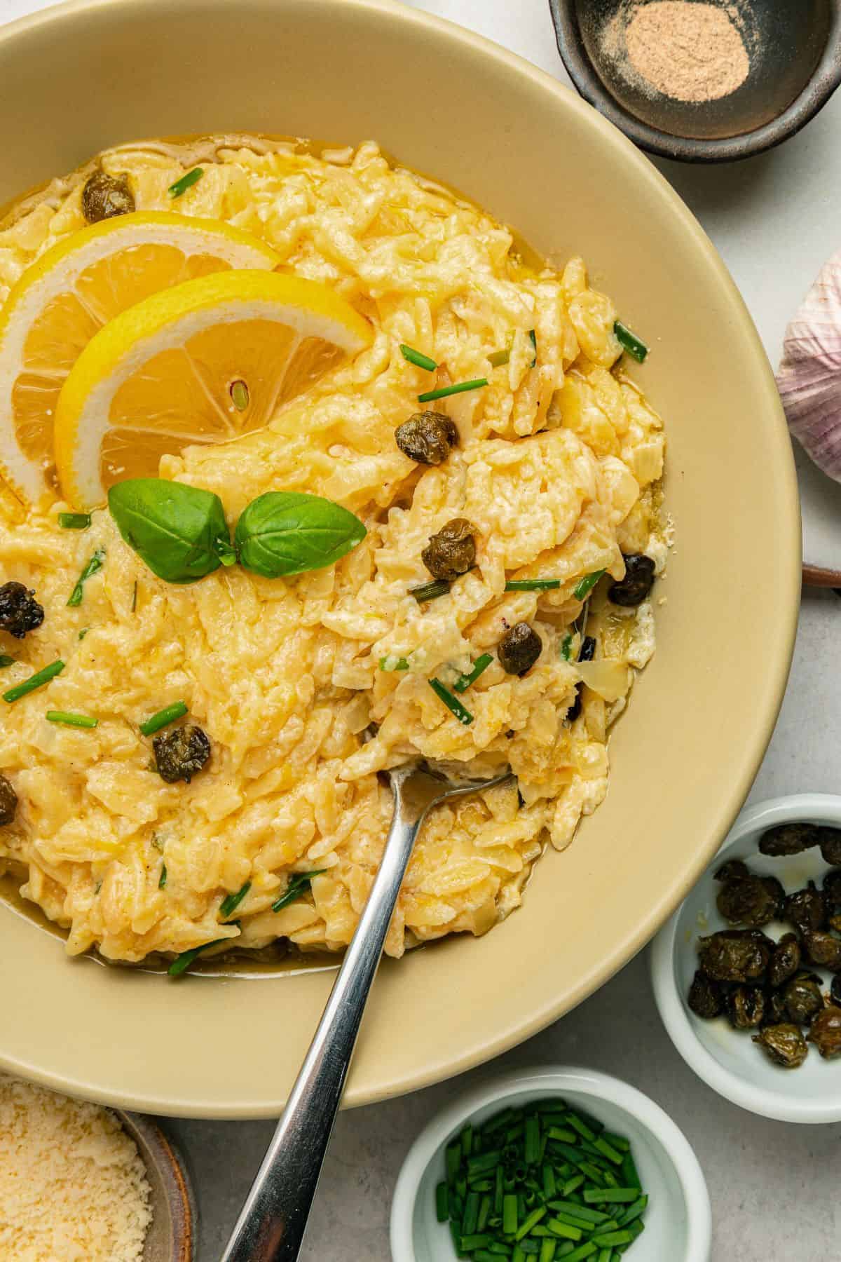 Creamy lemon orzo pasta finished with Parmesan, herbs, and crispy capers