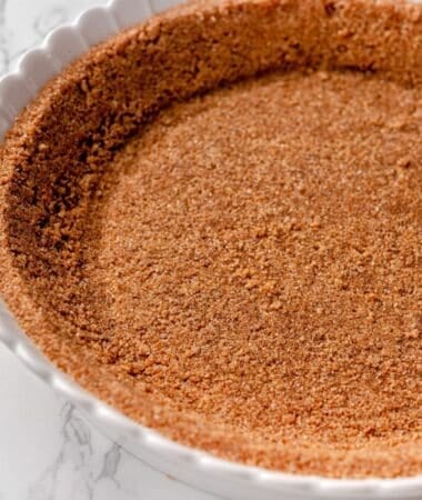 Graham cracker cookie crust made with melted butter and sugar