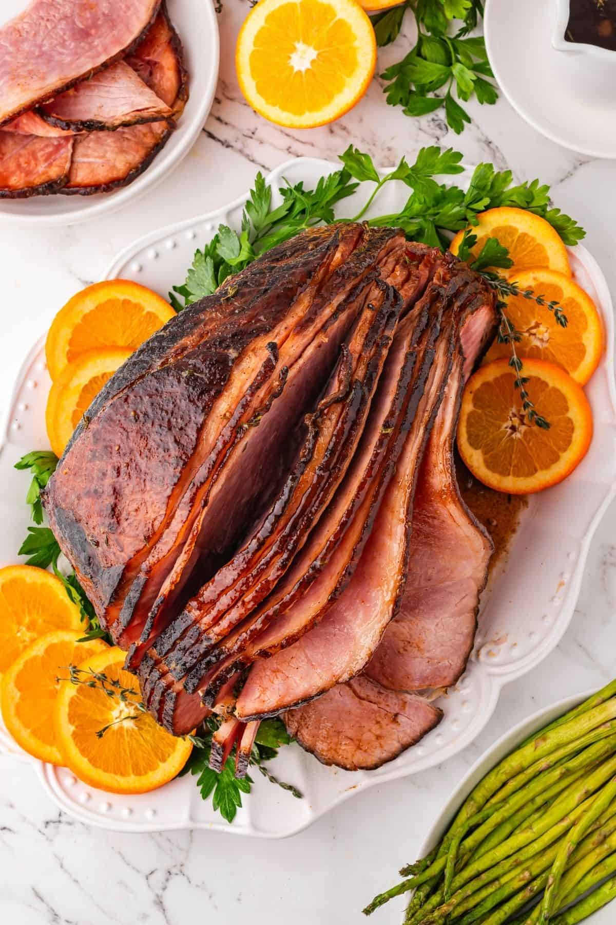 Baked spiral ham with layers of sticky honey and brown sugar glaze