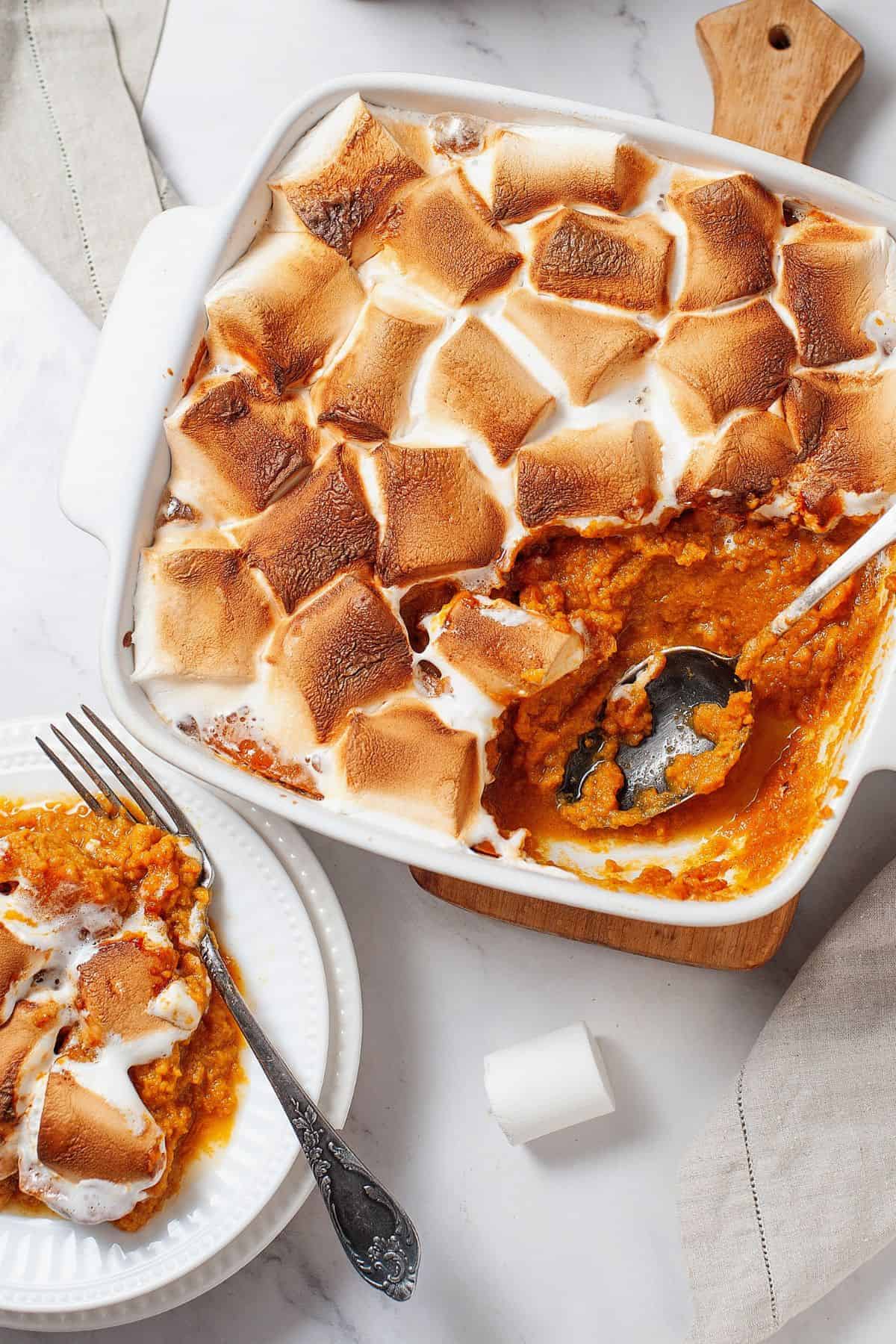 Baked sweet potato casserole with lightly browned marshmallows