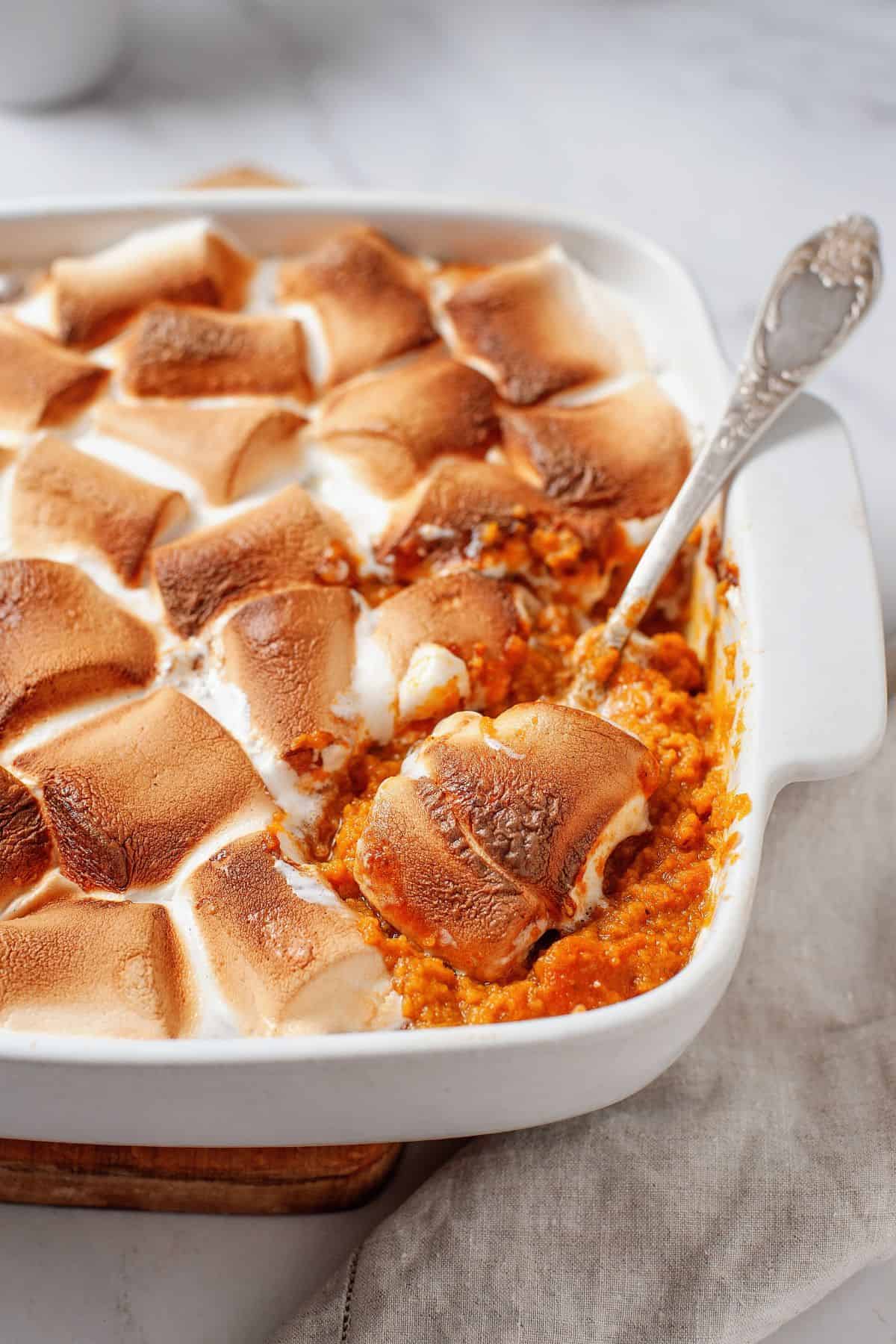 Holiday sweet potato casserole topped with toasted golden marshmallows