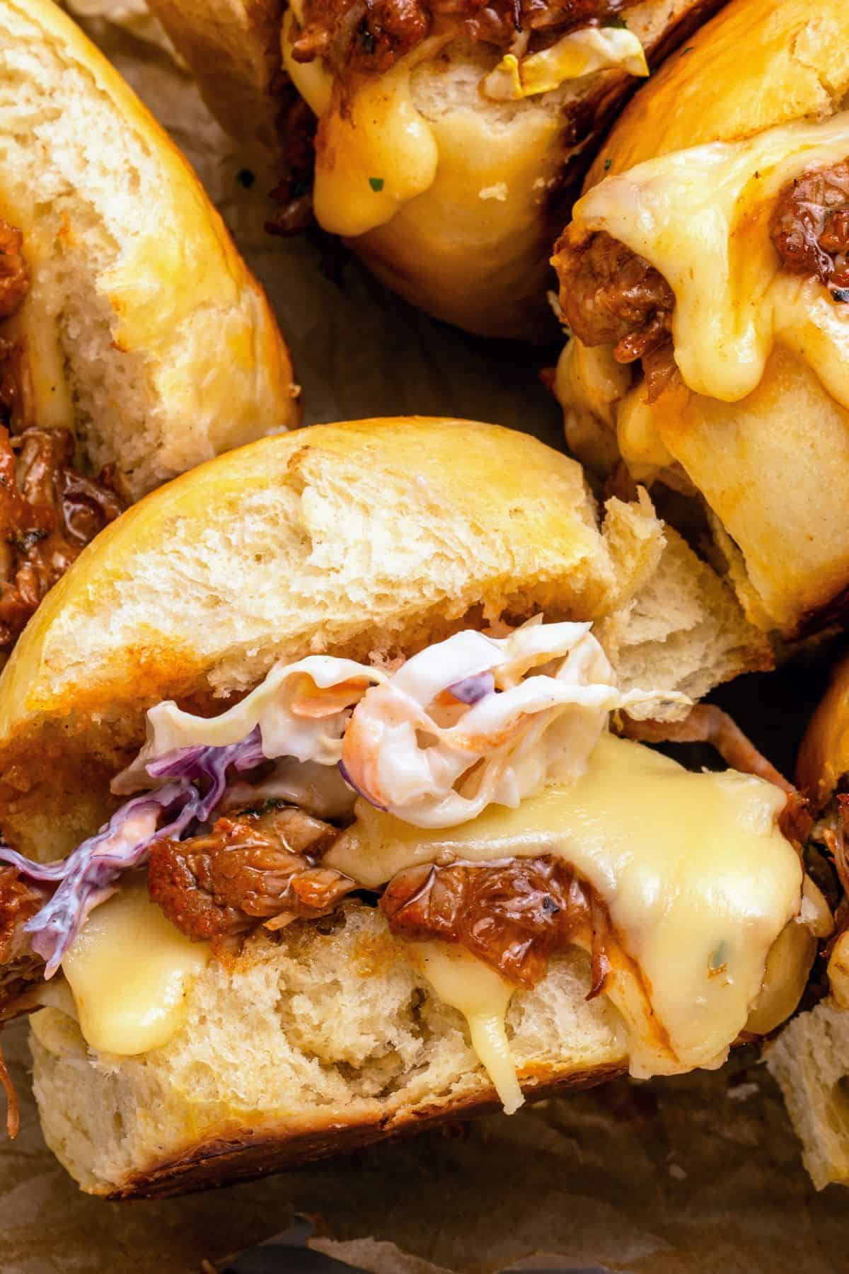 Pulled pork BBQ sliders baked with garlic butter and melted cheese