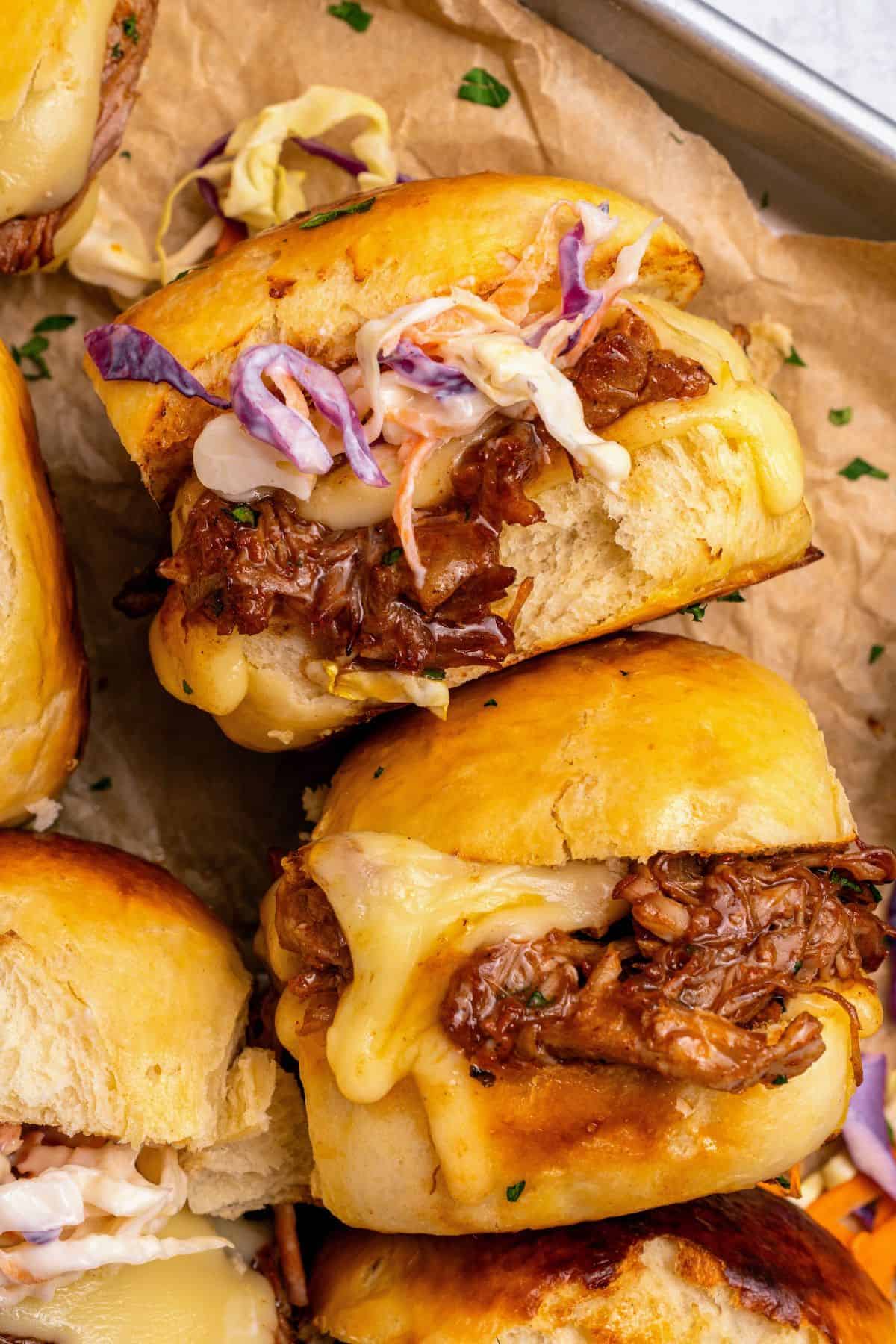 Barbecue pulled pork sliders with golden buttery Hawaiian roll tops