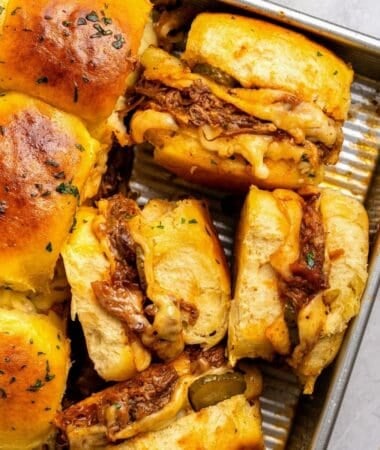Pulled pork BBQ sliders with cheesy pulled pork and tangy pickles