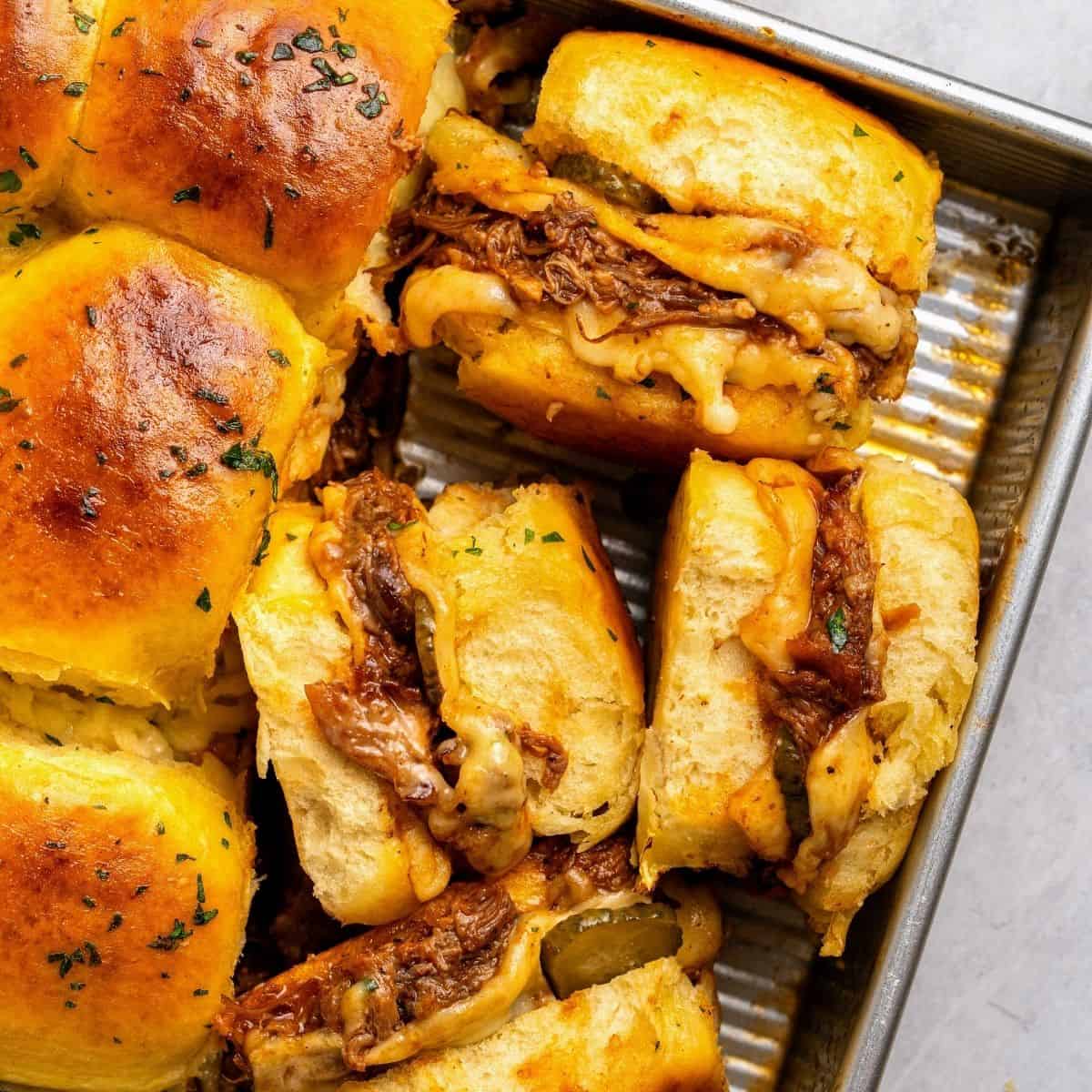 Pulled pork BBQ sliders with cheesy pulled pork and tangy pickles