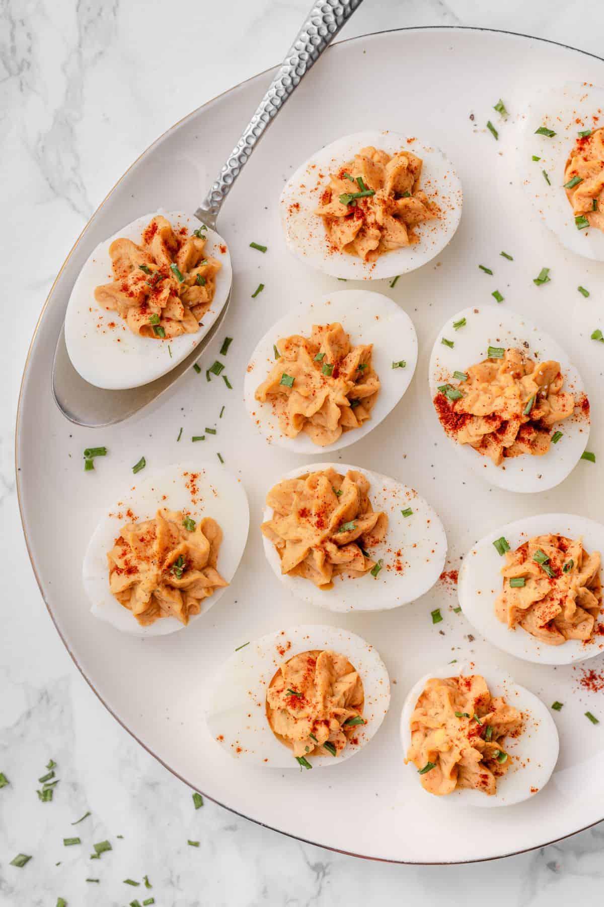 Easy deviled eggs recipe with sweet pickle relish and Dijon mustard