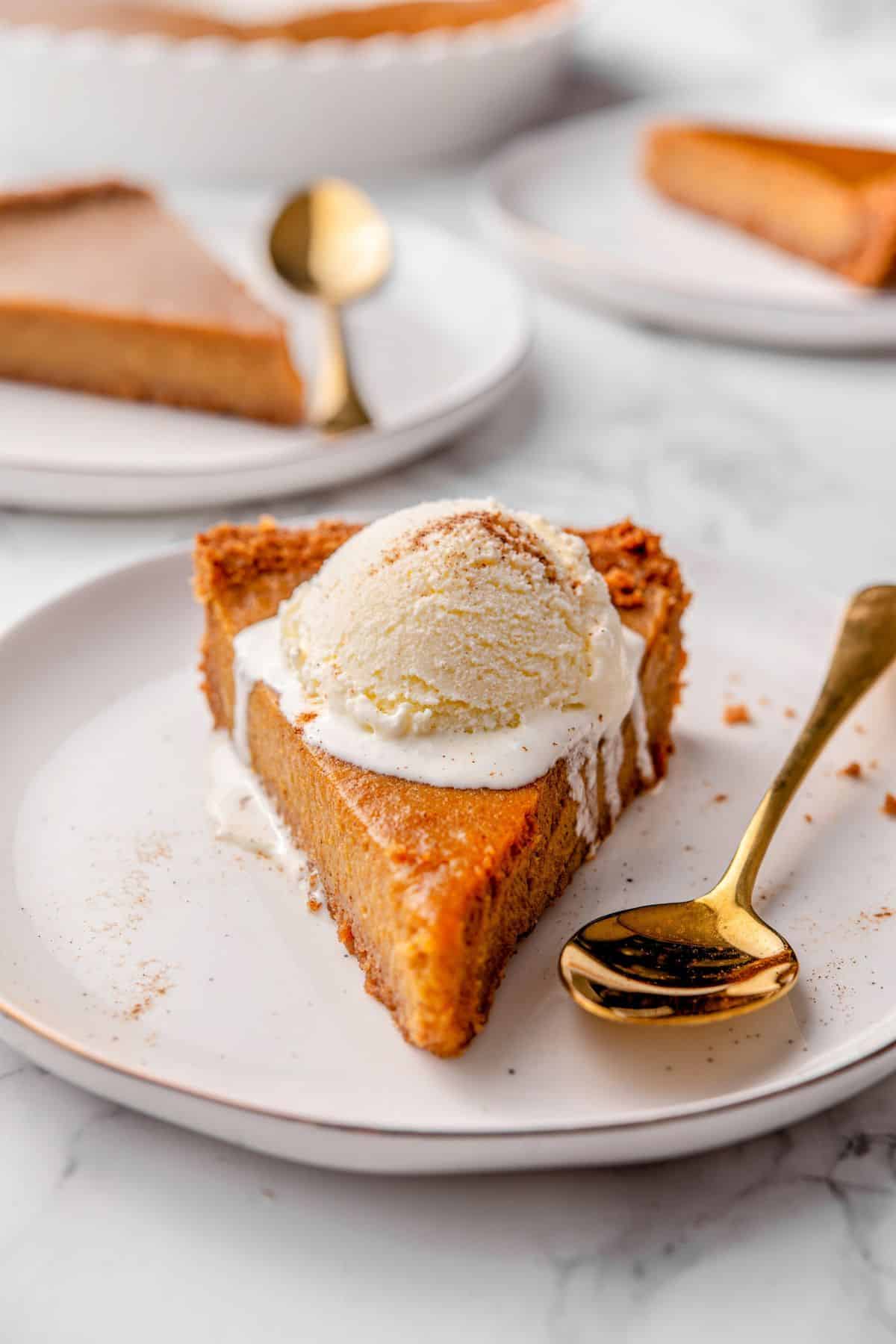Creamy pumpkin pie with graham cracker crust and warm pumpkin spice