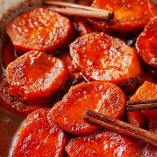 Homemade candied yams with a rich buttery cinnamon-orange syrup