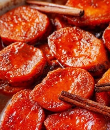 Homemade candied yams with a rich buttery cinnamon-orange syrup